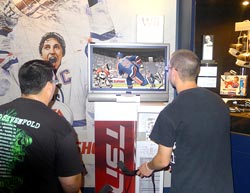 Friends become rivals while playing EA Sports NHL Slapshot at one of four Nintendo Wii gaming consoles.