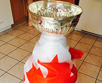 In honour of Canada Day, the Stanley Cup is draped in the Canadian flag.