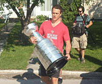 That's how he rolls. Blackhawks winger Andrew Shaw and his girlfriend welcome the Stanley Cup to Belleville, Ontario.