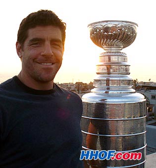 The Anaheim Ducks' Sean O'Donnell enjoys the view from the roof of his house with the Stanley Cup