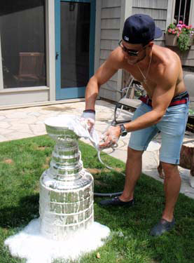 Gregory Campbell taking time to wash the Stanley Cup.