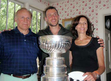 Gregory Campbell and his parents sharing a moment with the Stanley Cup.