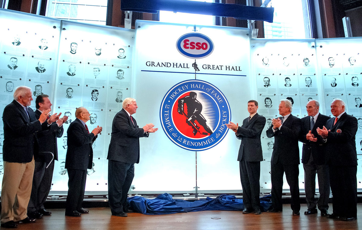 Bill Hay, Hockey Hall of Fame Chairman and CEO, along with Imperial Oil Limited executives and HHOF Honoured Members, officially unveil the Esso Great Hall.