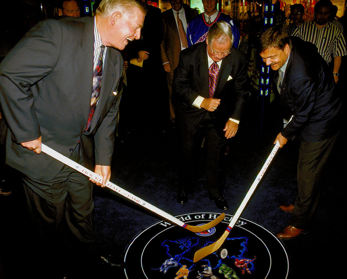 Bill Hay, HHOF Chairman and CEO, Scotty Morrison, former HHOF President, and René Fasel, President of the International Ice Hockey Federation, launch the Tissot World of Hockey Zone.